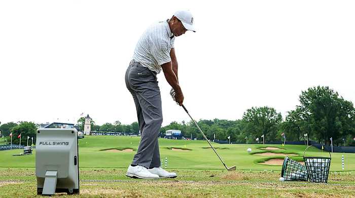 Tiger Woods works on the range with a Full Swing launch monitor at the 2022 PGA Championship at Southern Hills.